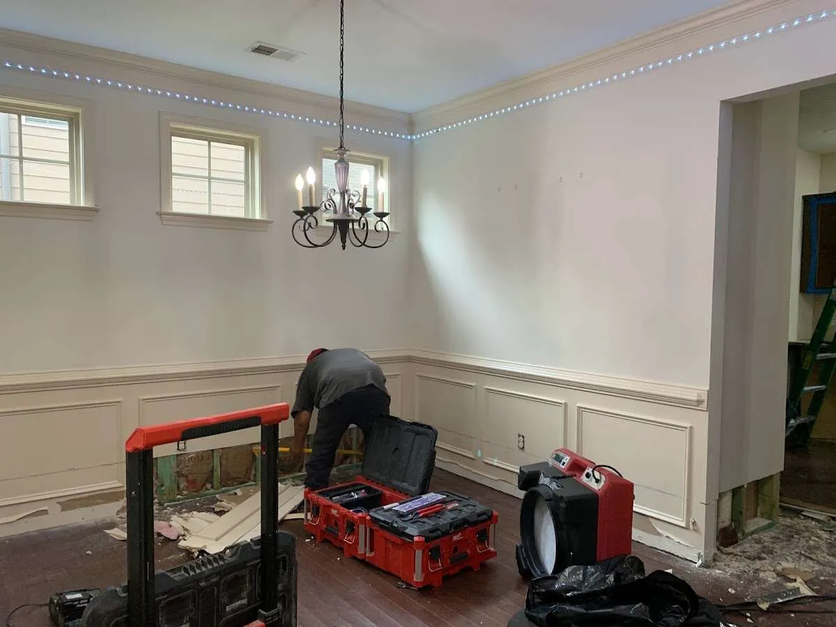 Restoration technician with professional equipment in Mayflower Village